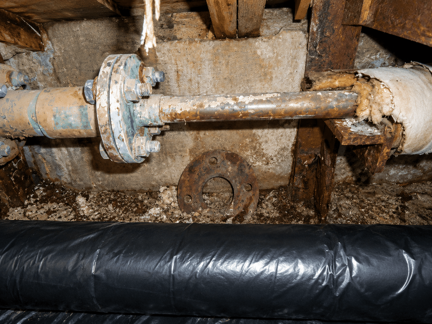 Friable asbestos gasket material in an industrial plant room