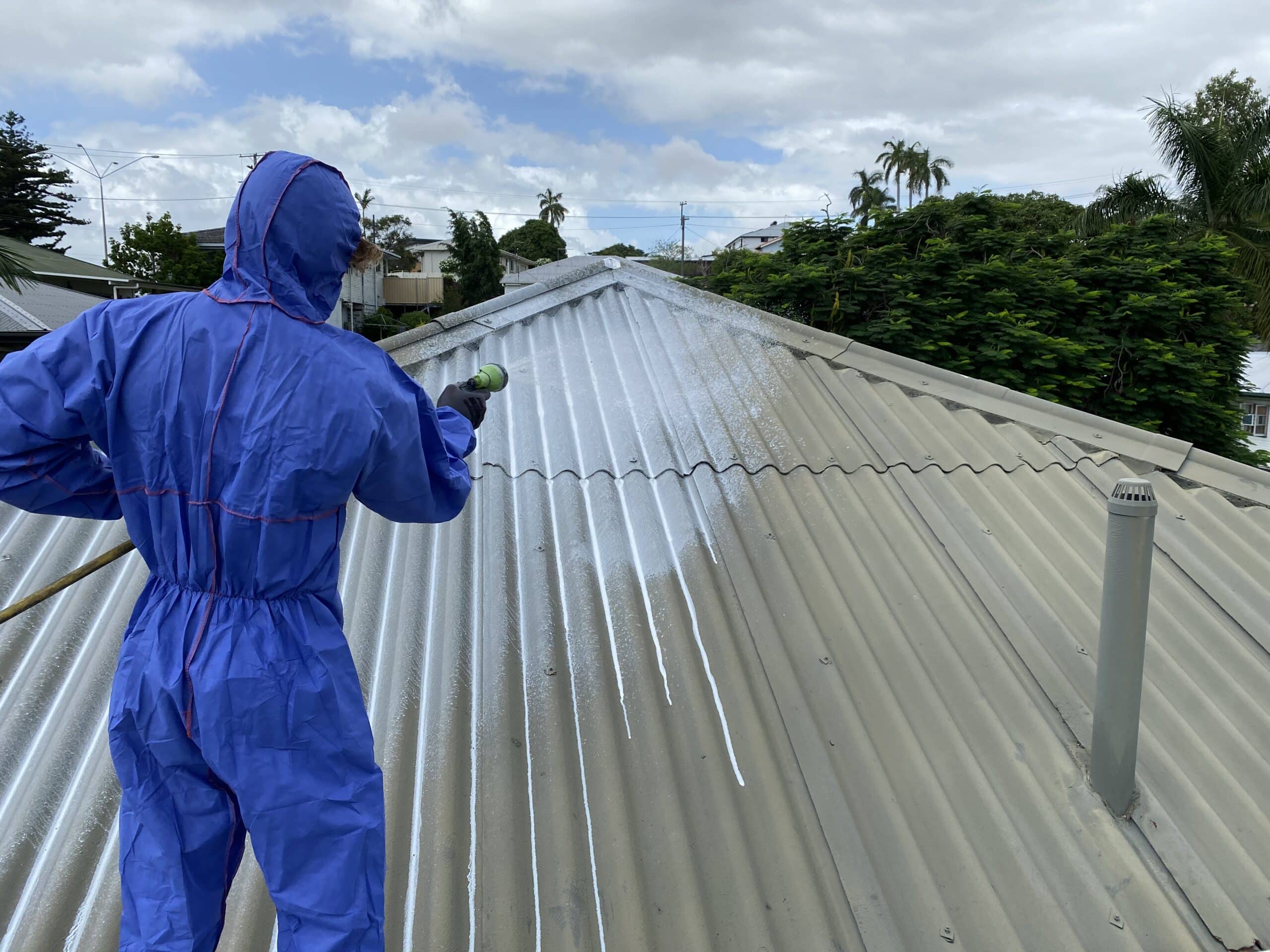 Asbestos roof being sealed in preparation for removal