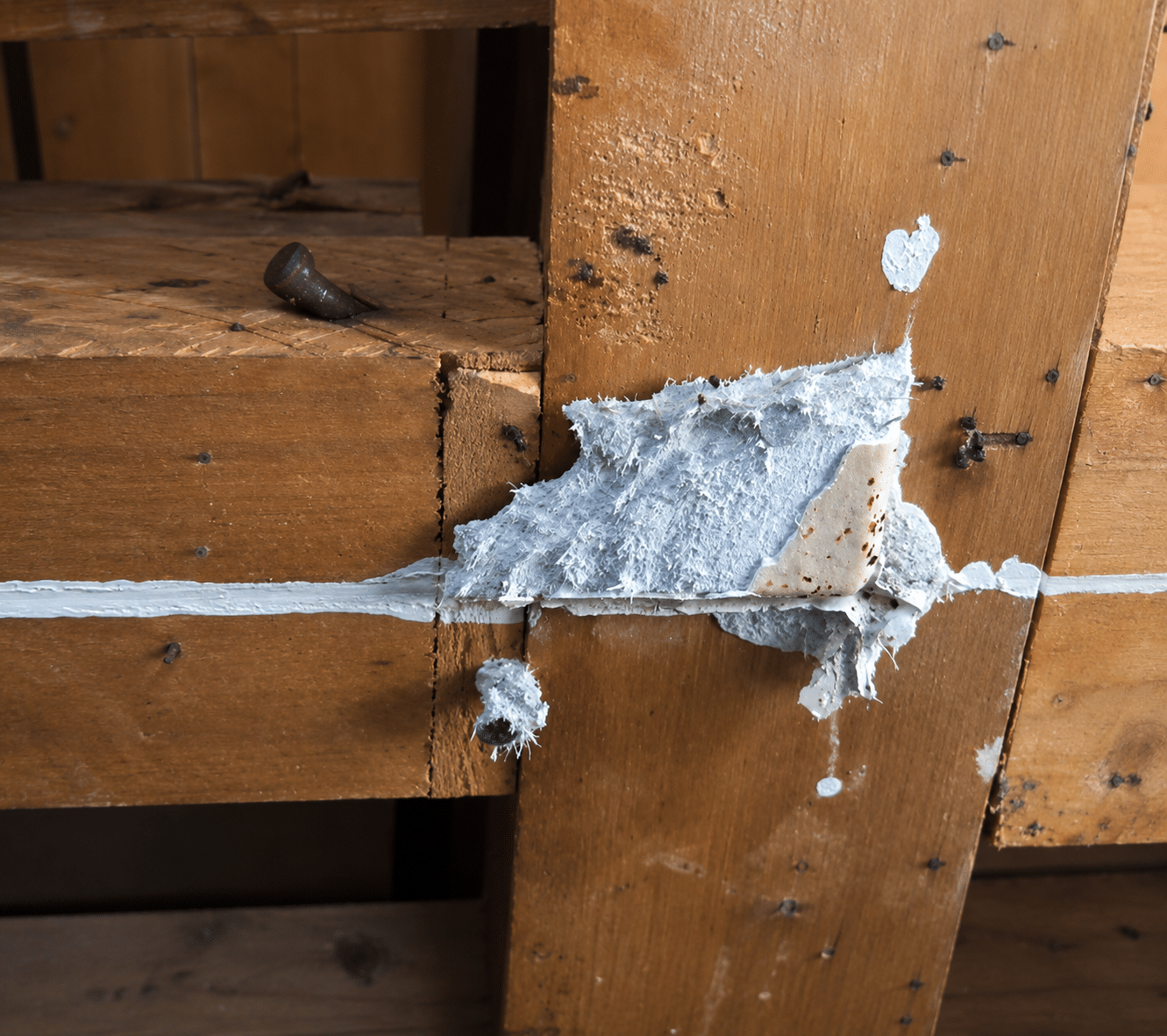 Severely degraded asbestos cement sheeting treated as friable material.