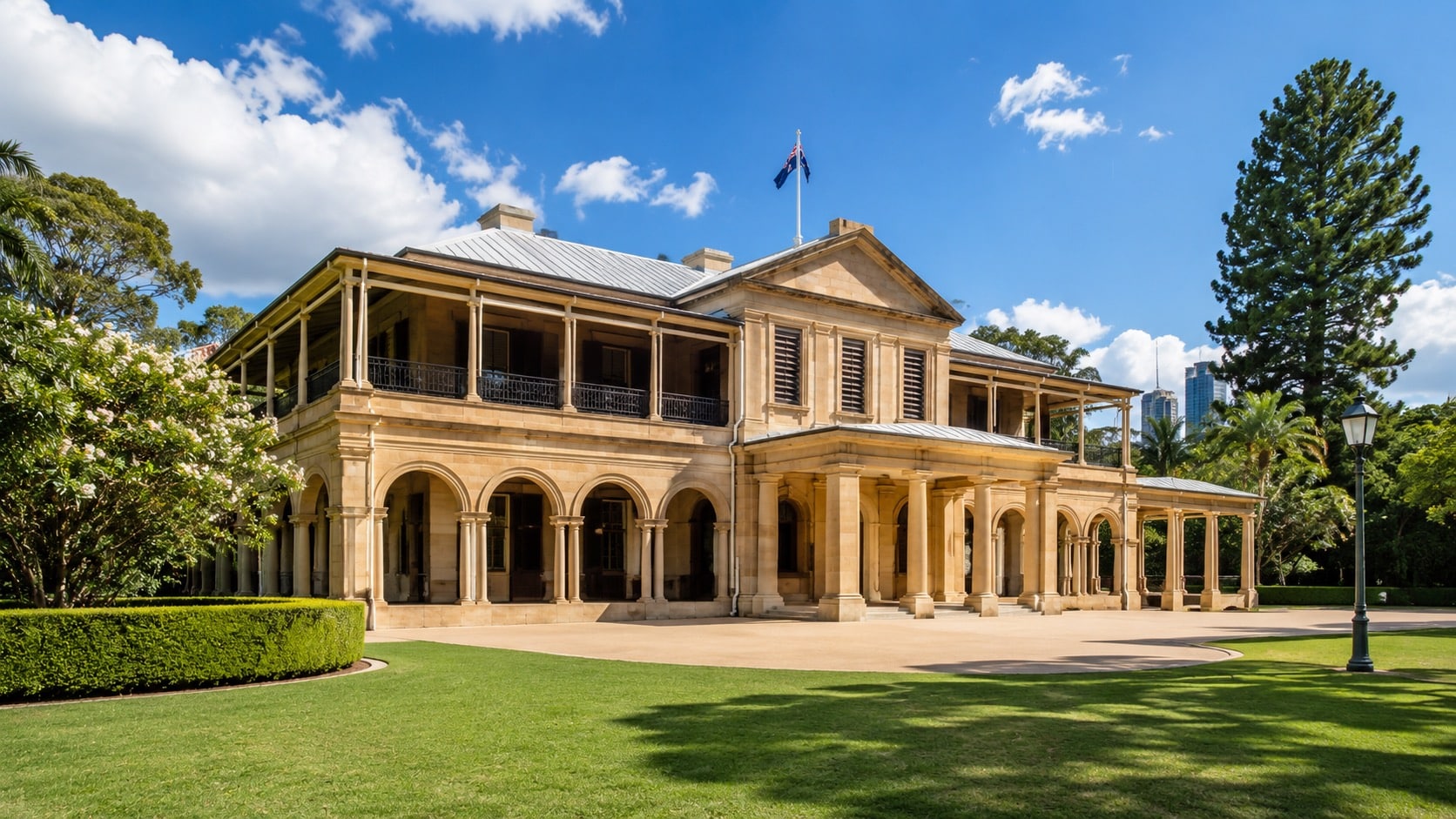 Heritage government building with sandstone facade and manicured grounds