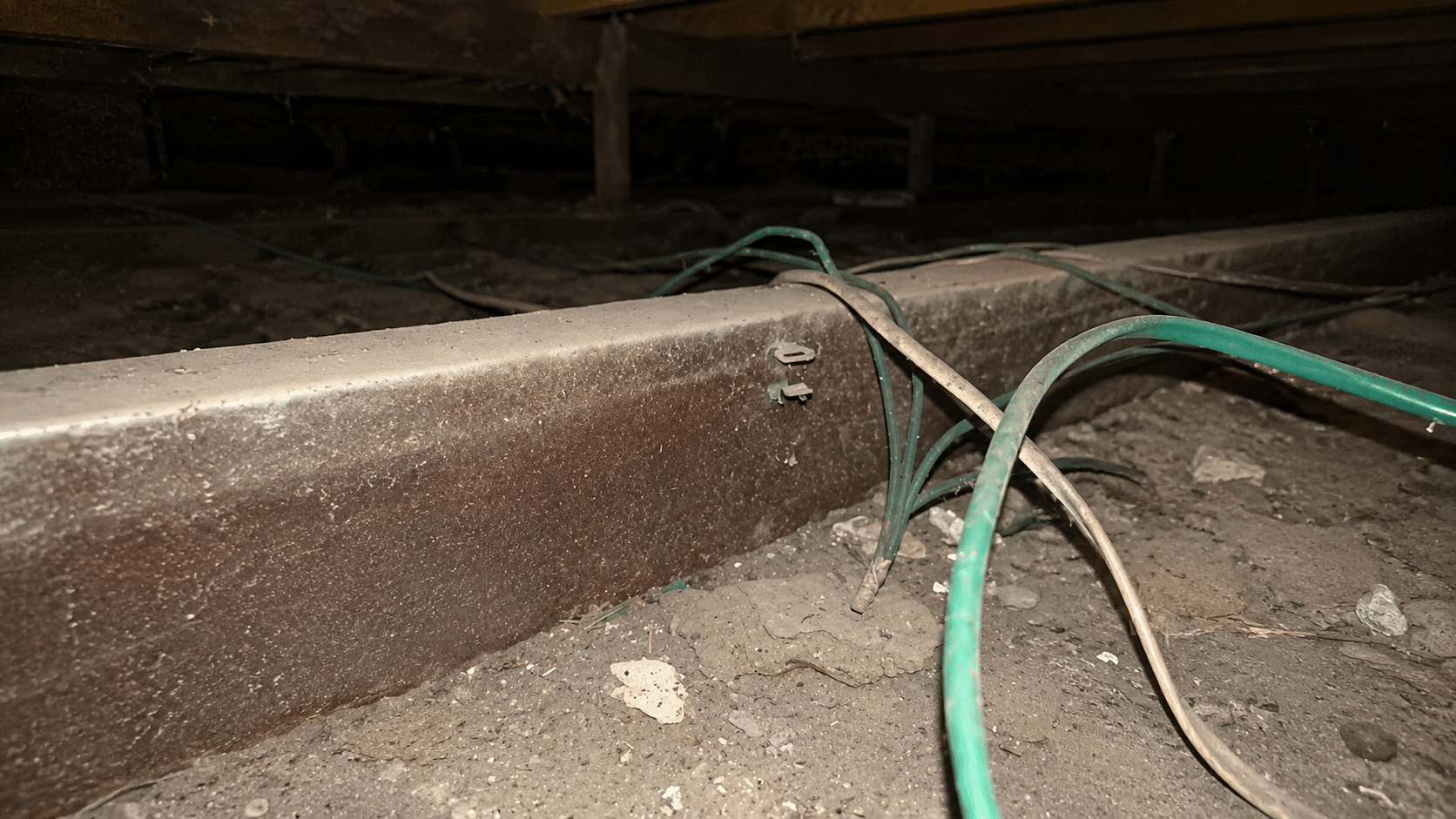 Loose asbestos dust and debris found in a ceiling cavity during inspection.