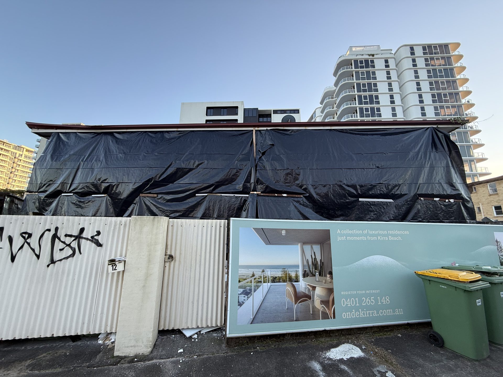 Asbestos containment sheeting in place