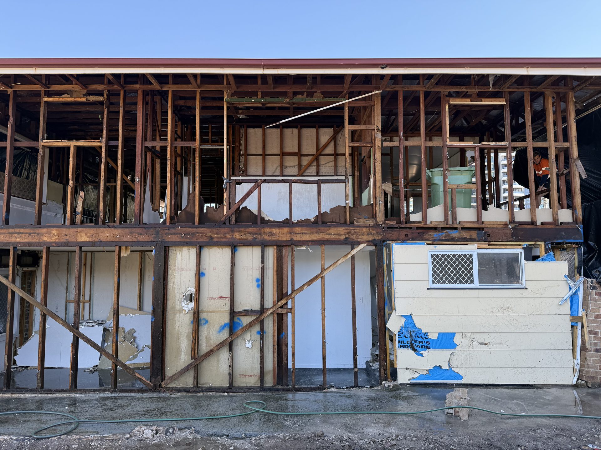 Crew stripping the rear elevation
