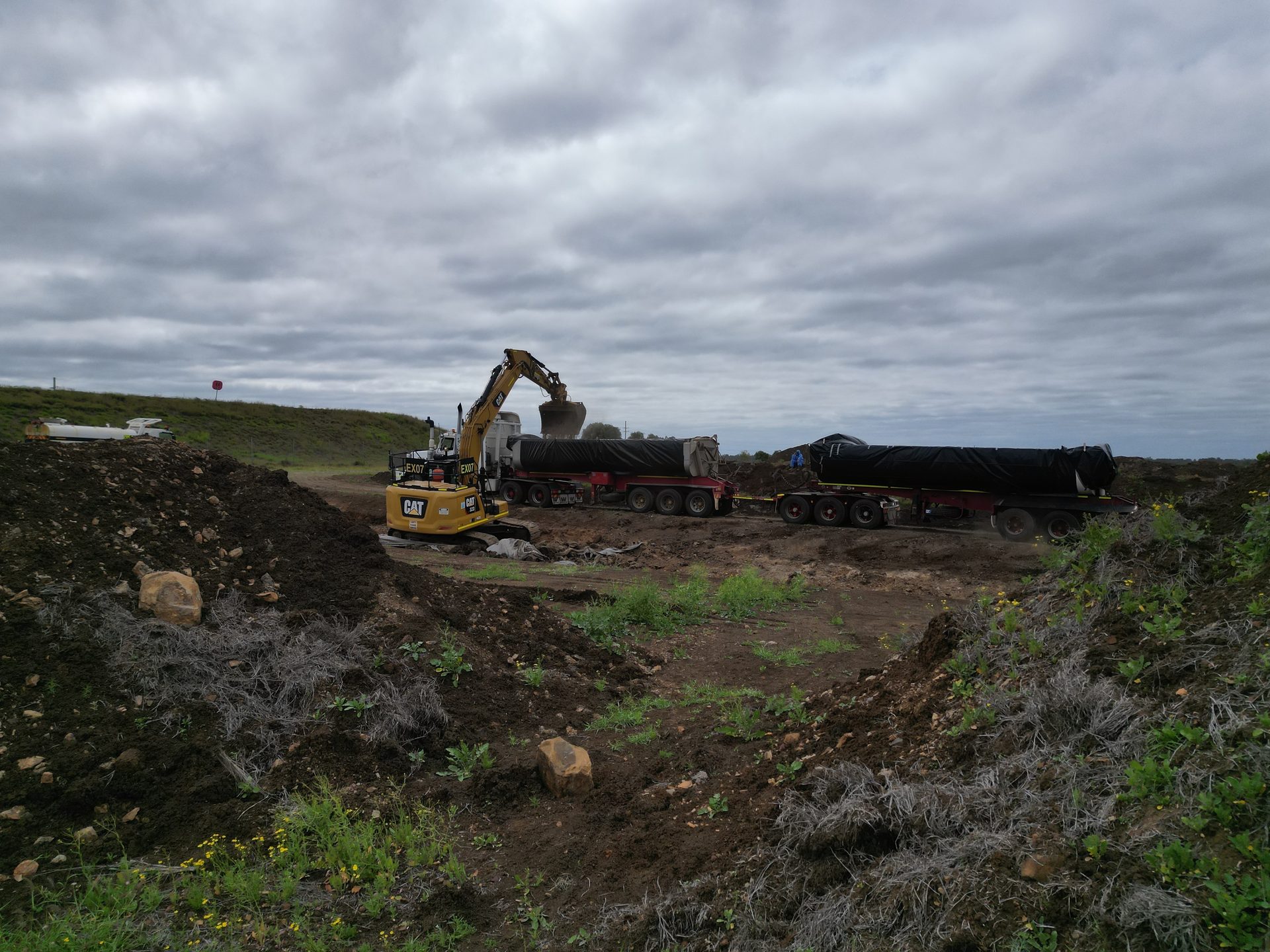 Loading contaminated soil for haulage