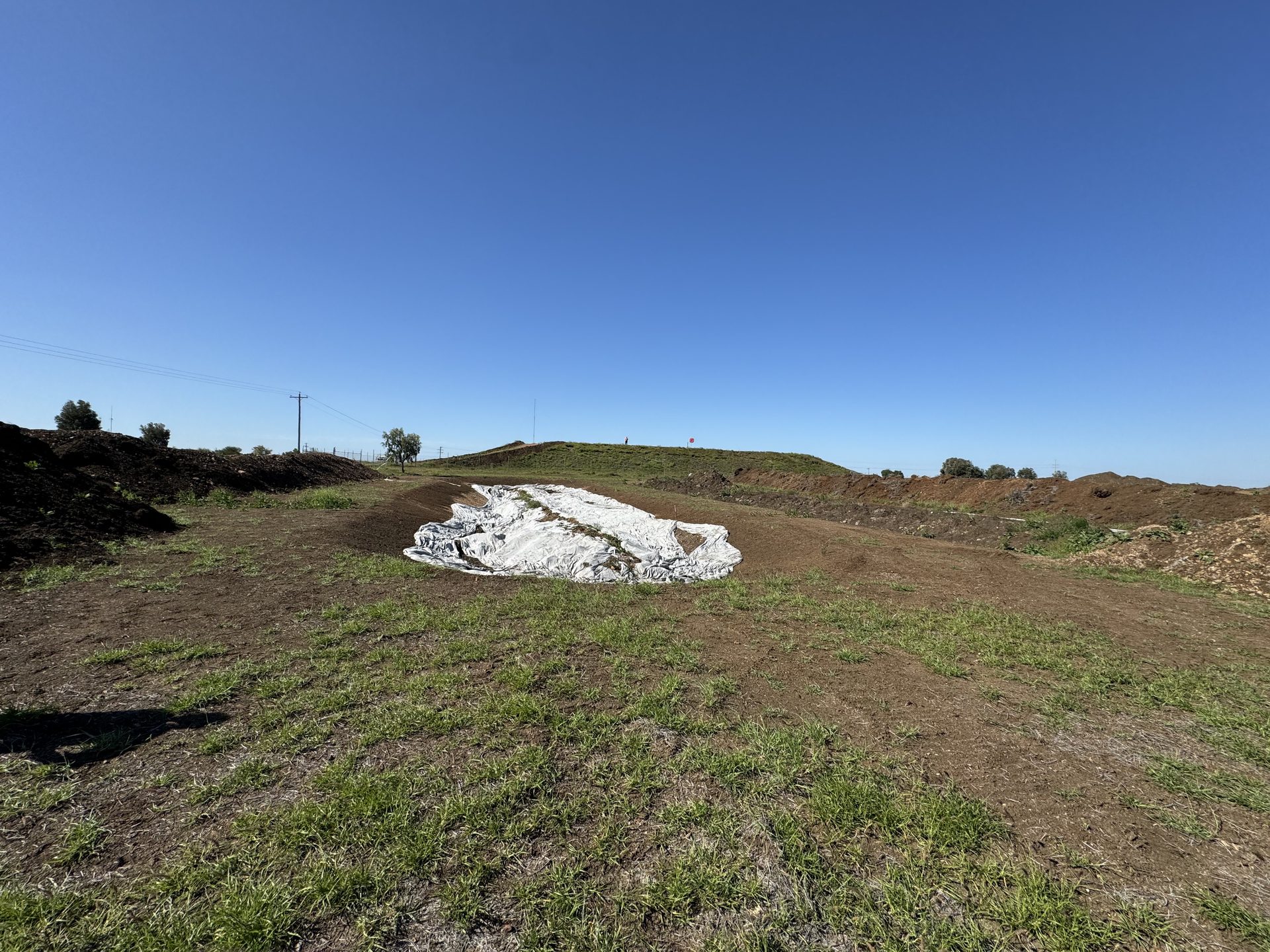 Capping plastic over remediated ground