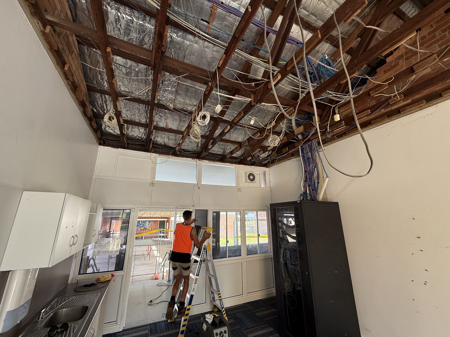 Friable ceiling removal in progress